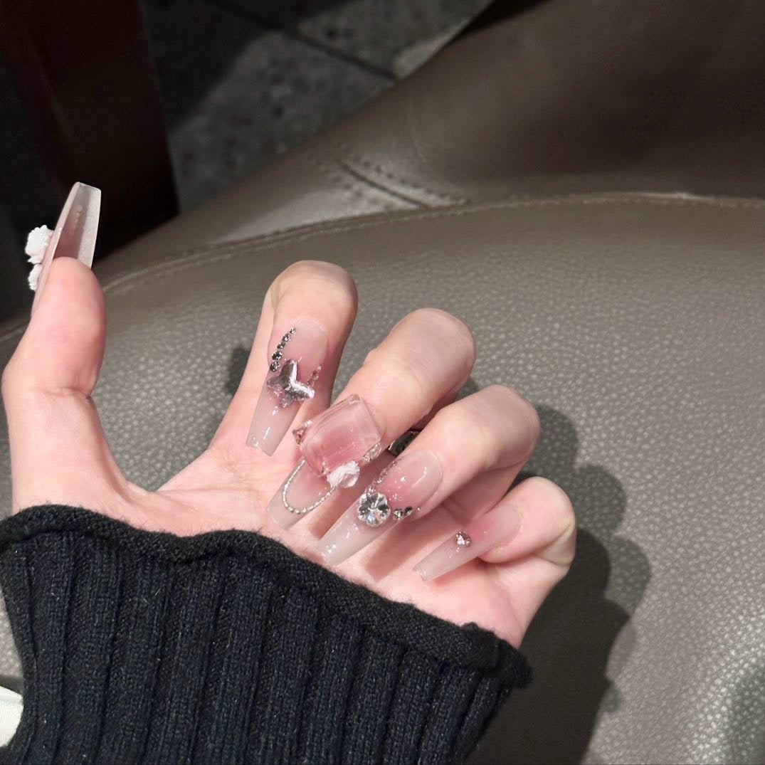 Embrace feminine elegance with the Blush Bloom Press-On Nails, a delicate yet luxurious set inspired by romantic florals and soft pink hues. This design blends dreamy ombré shades with intricate 3D embellishments, creating a look that’s both graceful and enchanting.