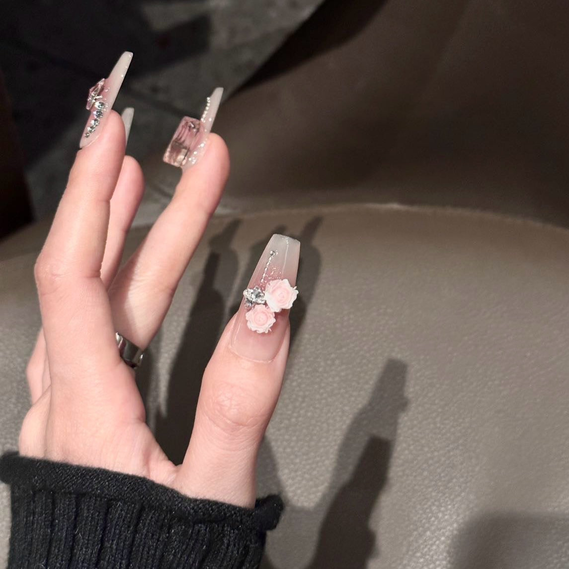 Embrace feminine elegance with the Blush Bloom Press-On Nails, a delicate yet luxurious set inspired by romantic florals and soft pink hues. This design blends dreamy ombré shades with intricate 3D embellishments, creating a look that’s both graceful and enchanting.