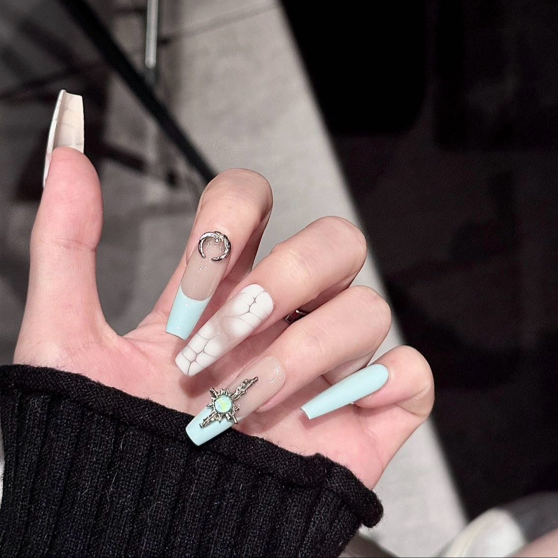 Boho Luxe Press-On Nails bring together a sophisticated mix of textures and colors, combining crocodile-inspired patterns with pastel accents of mint, blush pink, and nude taupe. Adorned with ornate silver charms and gemstone details, these nails capture an elegant bohemian vibe with a touch of luxury.
