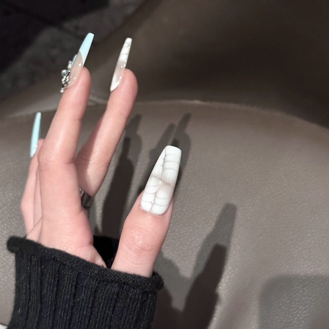 Boho Luxe Press-On Nails bring together a sophisticated mix of textures and colors, combining crocodile-inspired patterns with pastel accents of mint, blush pink, and nude taupe. Adorned with ornate silver charms and gemstone details, these nails capture an elegant bohemian vibe with a touch of luxury.
