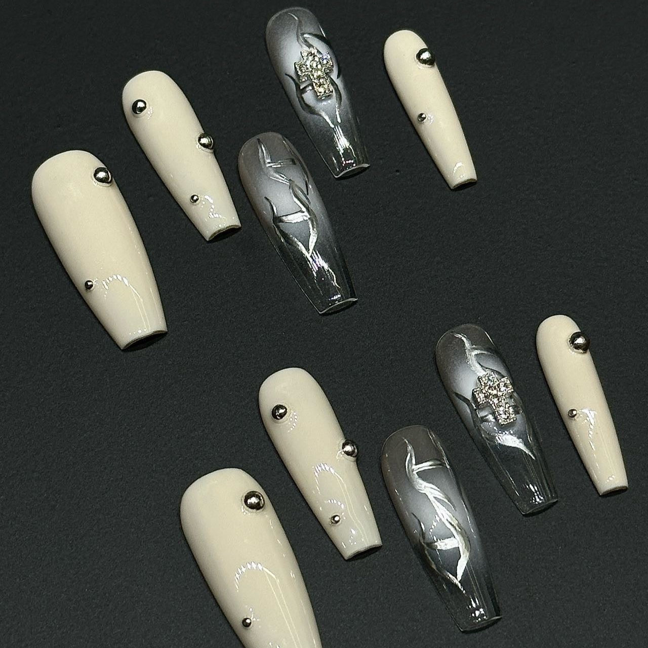 Step into a world of elegance and contrast with the Ivory Eclipse Press-On Nails, a sophisticated blend of creamy ivory and sleek metallic silver. This design combines modern minimalism with bold accents, making it perfect for those who love a refined yet striking aesthetic.