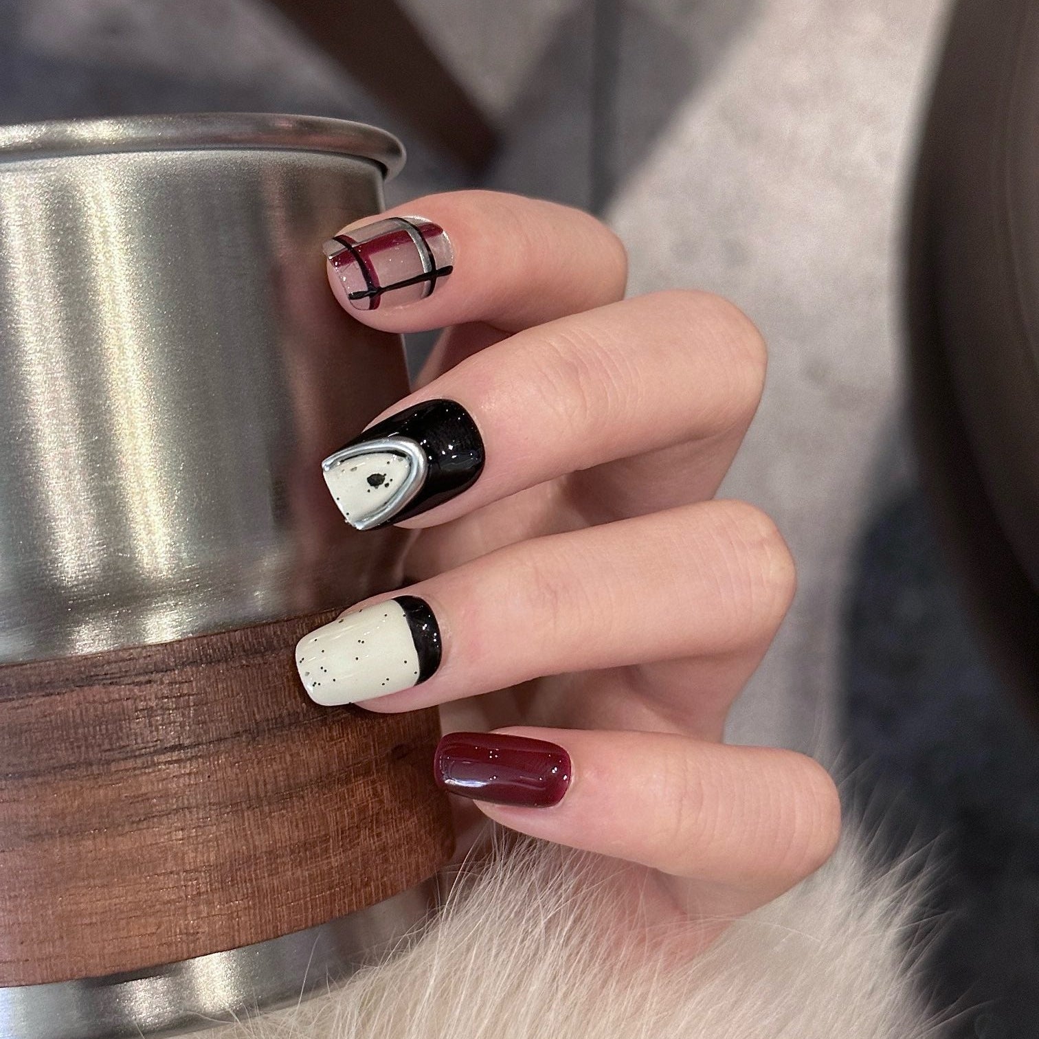 Step into bold sophistication with Midnight Plaid Press-On Nails, a chic blend of deep burgundy, glossy black, and creamy ivory tones enhanced with metallic silver accents. This set features a modern plaid pattern, glossy solids, and edgy chrome details, creating a contemporary yet timeless look. With a playful mix of patterns and minimalist speckles, Midnight Plaid is the perfect fusion of classic elegance and urban flair.