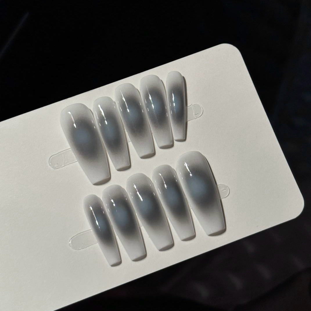 Misty Veil Press-On Nails offer a dreamy, ethereal aesthetic with a soft, clouded gradient that exudes elegance and mystery.