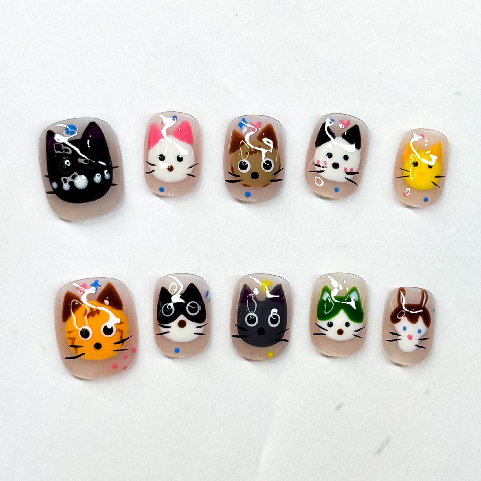Bring a touch of playful charm to your nails with Kitty Squad — a collection of 10 unique cat faces, each with its own personality and flair. From curious tabbies to cheeky tuxedos, these nails are a celebration of every cat lover’s dream.

Key Features:
• Cute & Quirky: Each nail features a different kitty design, hand-painted with 3D gel details.
• Short Square Shape: Easy to wear daily while keeping a fun and playful look.
• Colorful Variety: Includes a mix of bright, bold, and neutral tones to match any