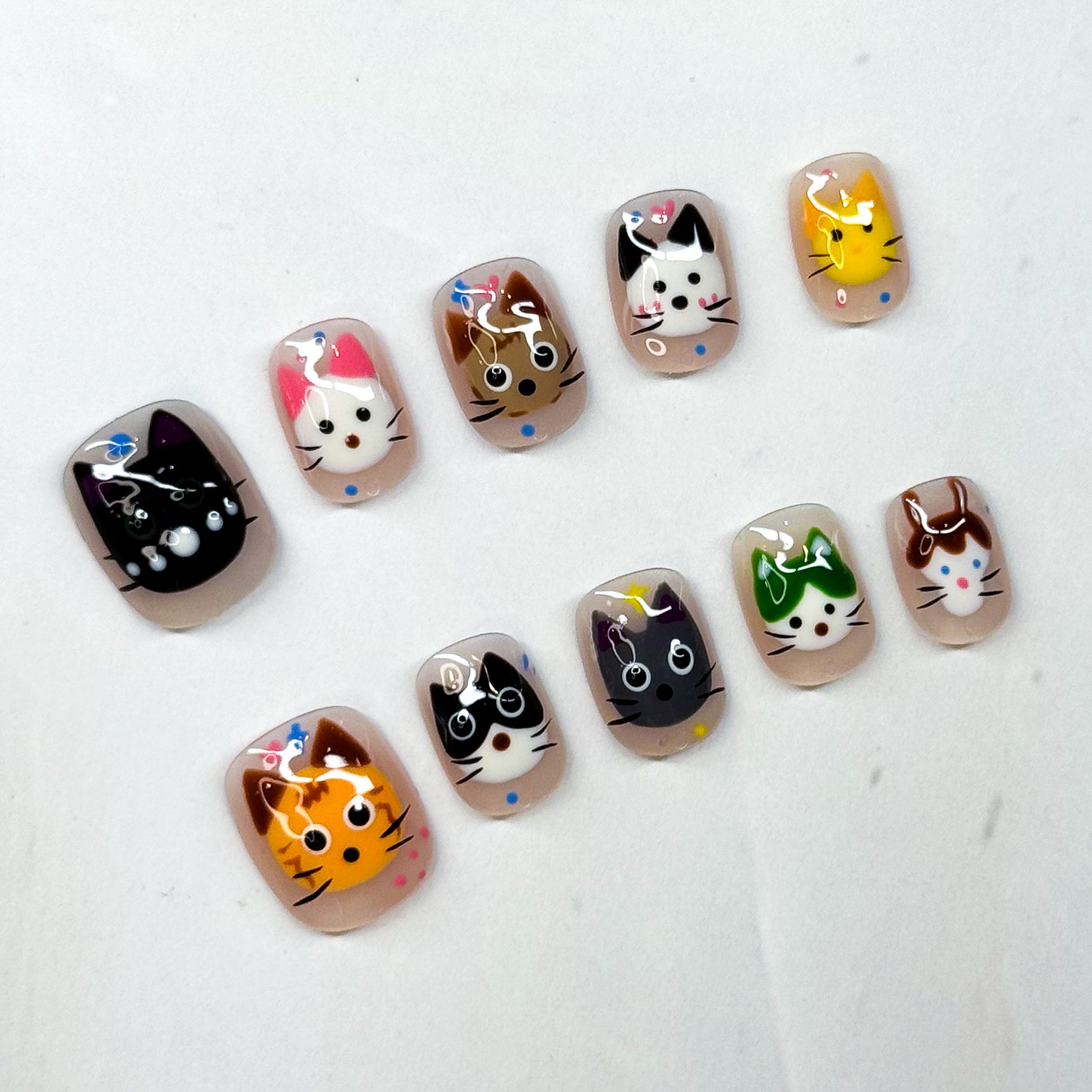 Bring a touch of playful charm to your nails with Kitty Squad — a collection of 10 unique cat faces, each with its own personality and flair. From curious tabbies to cheeky tuxedos, these nails are a celebration of every cat lover’s dream.

Key Features:
• Cute & Quirky: Each nail features a different kitty design, hand-painted with 3D gel details.
• Short Square Shape: Easy to wear daily while keeping a fun and playful look.
• Colorful Variety: Includes a mix of bright, bold, and neutral tones to match any
