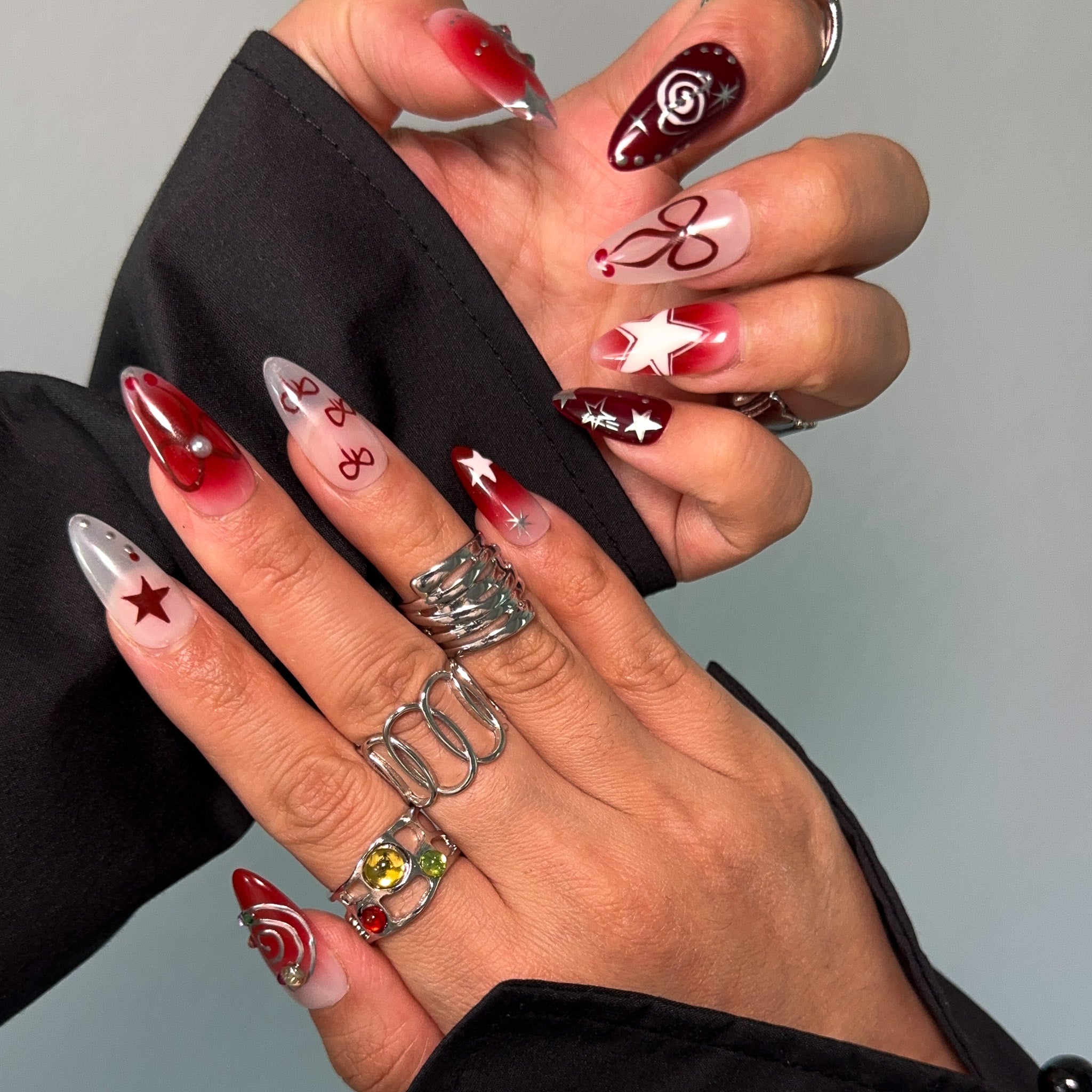 Starlit Celebration Press-On Nails are the perfect festive accessory for those who love to sparkle and shine! Designed with a mix of rich red and deep burgundy hues, these nails are adorned with glittering stars, playful bows, and swirling festive patterns. The gradient ombre effect adds a touch of elegance, making them ideal for holiday parties, special events, or whenever you feel like adding a dash of magic to your look.