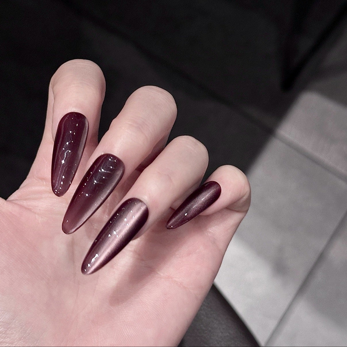 Elevate your style with Plum Mirage Press-On Nails. These extra-long almond-shaped nails feature a rich plum cat-eye finish that shimmers with captivating depth and elegance. The sleek silhouette and luxurious color create a sophisticated look that’s perfect for any occasion.