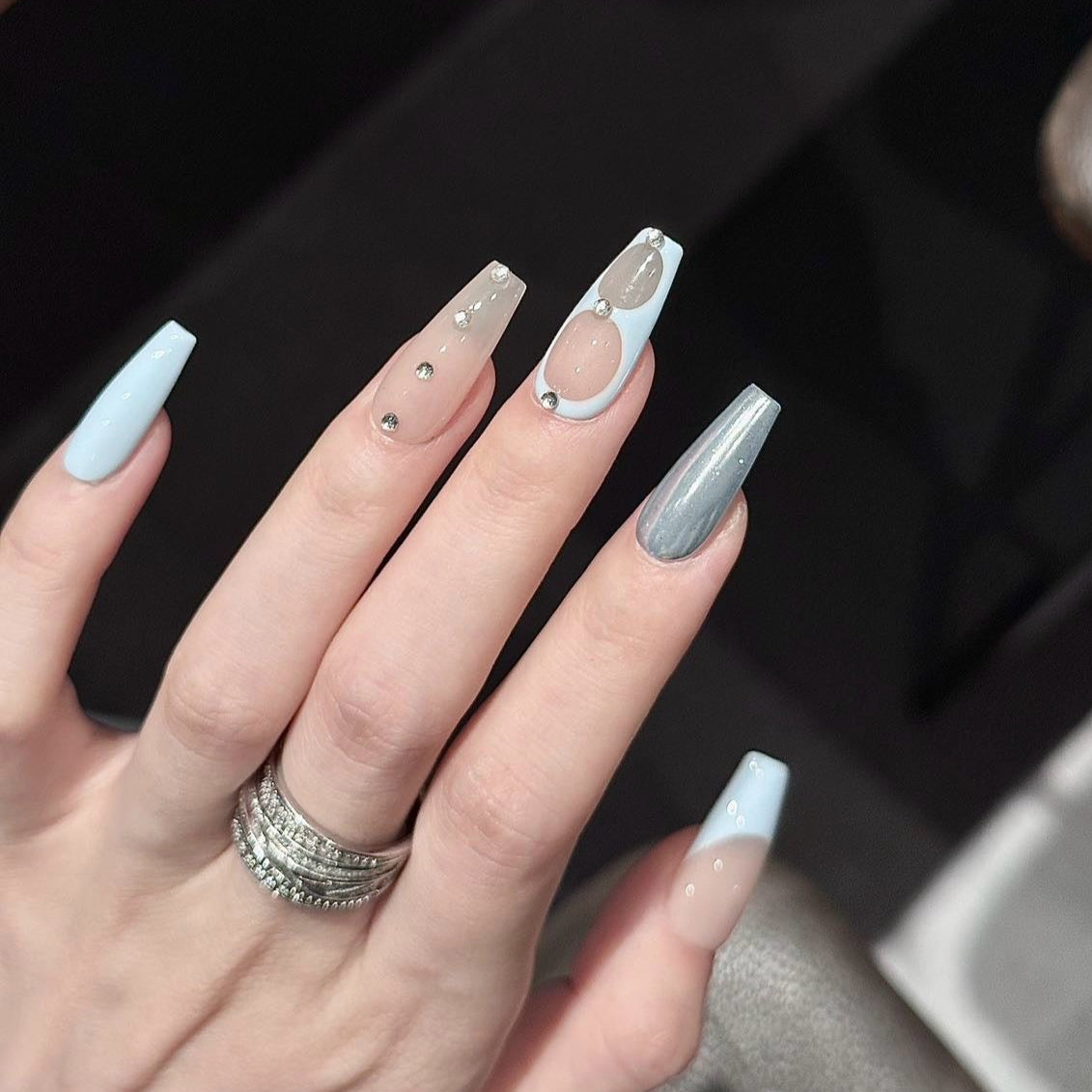 Serene Luxe Press-On Nails embody a perfect blend of minimalist sophistication and modern elegance. Featuring soft nude, baby blue, crisp white, and metallic silver accents, this set offers a dreamy, polished look for any occasion.
