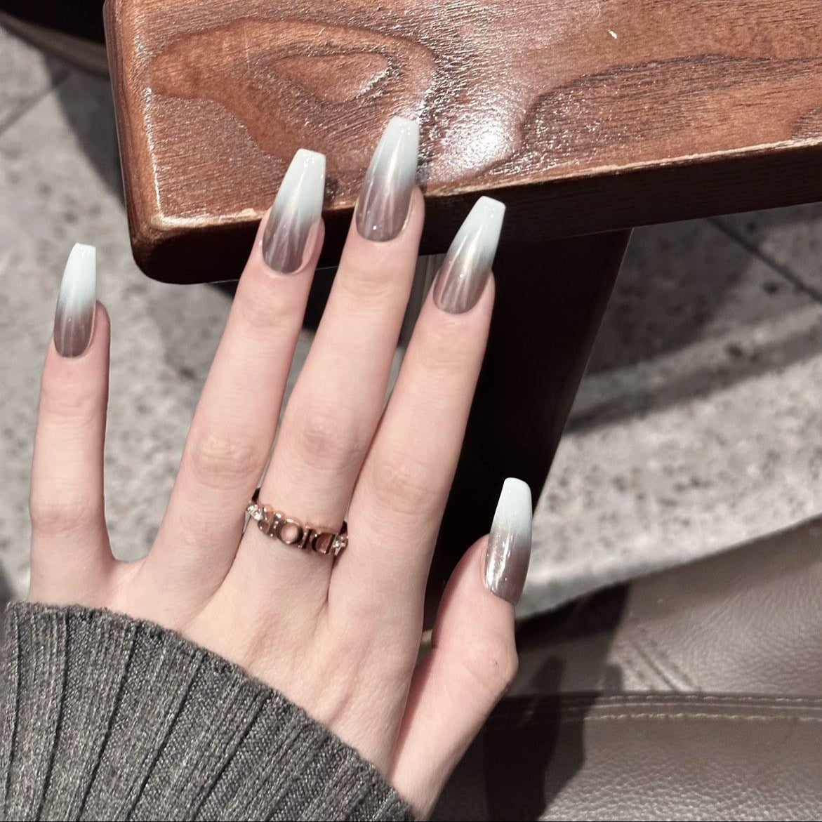 Silver Mist Press-On Nails are the epitome of modern elegance with a soft silver chrome finish that seamlessly blends into a translucent white base. These nails create a dreamy ombre effect that captures light beautifully, giving your hands a sophisticated, ethereal glow.