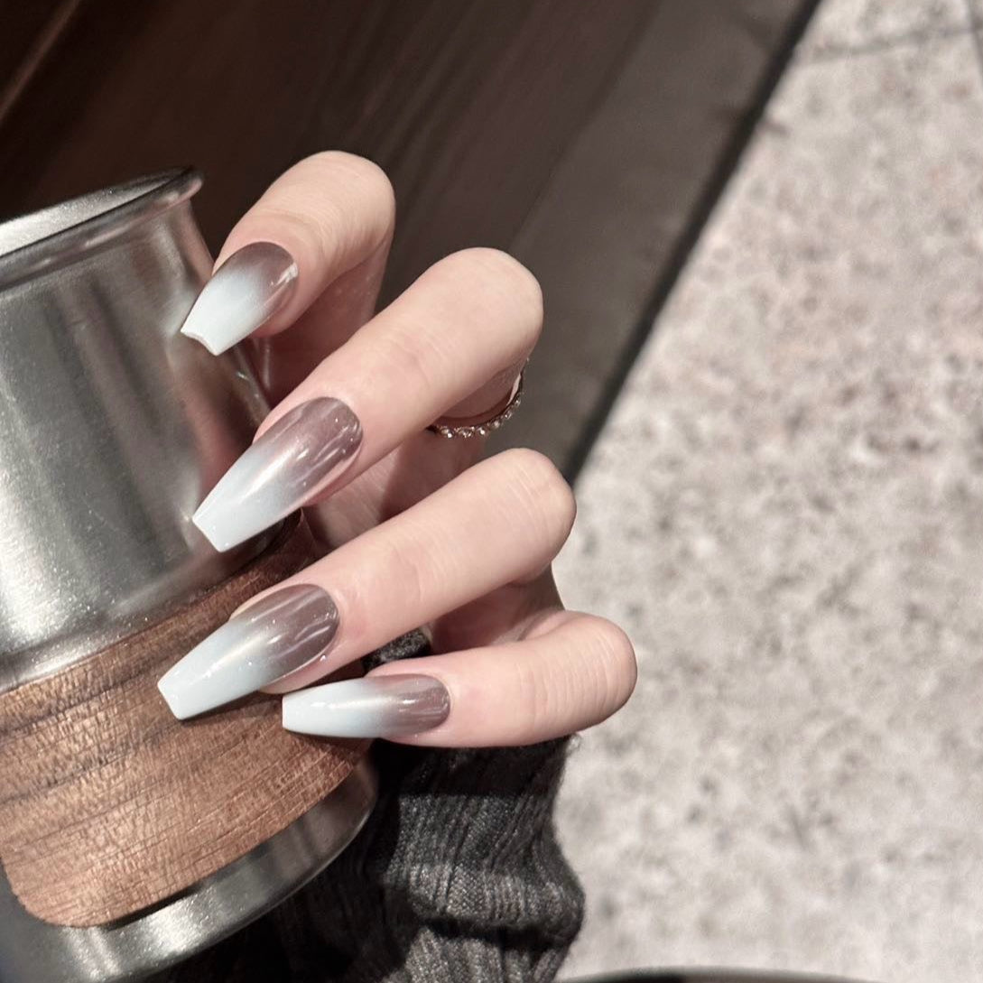 Silver Mist Press-On Nails are the epitome of modern elegance with a soft silver chrome finish that seamlessly blends into a translucent white base. These nails create a dreamy ombre effect that captures light beautifully, giving your hands a sophisticated, ethereal glow.